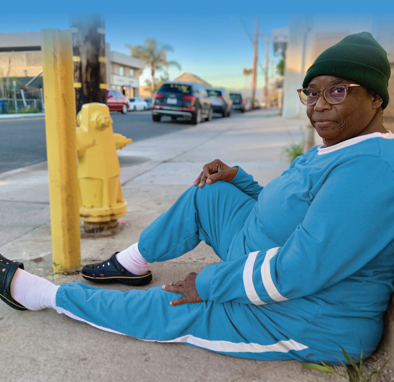 woman sitting on street